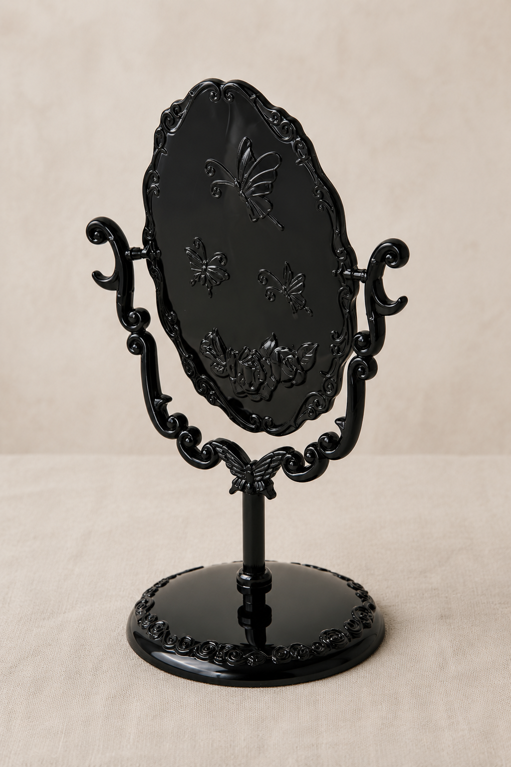 Miroir coiffeuse papillon, noir 22×16 cm. Vu de l'arrière ou en cours d'installation.
